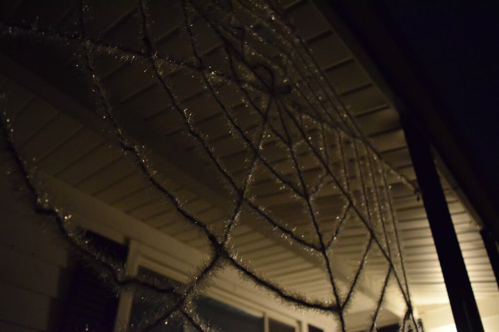Our Halloween spiderweb decoration on the front porch