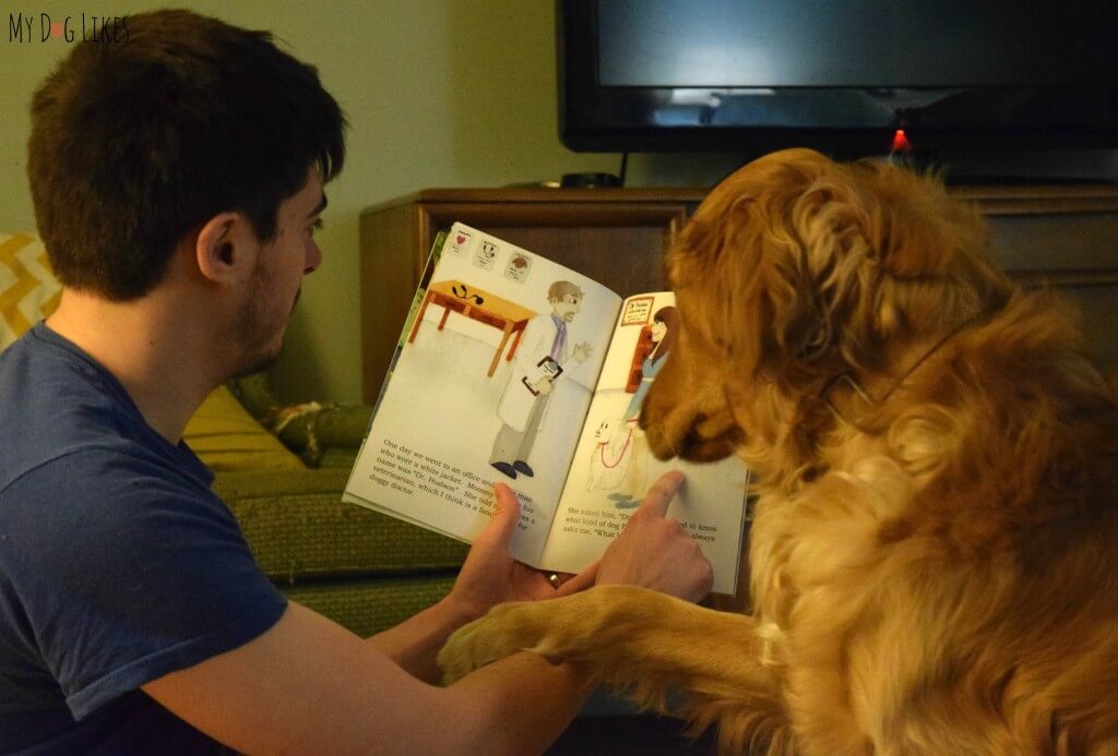 Reading "What Kind of Dog Am I?" children's book to our dog Charlie. This story has a great message about adoption and identity.
