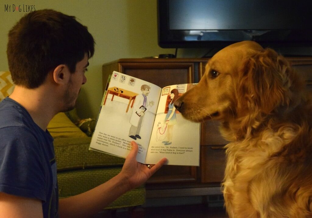 Charlie listening closely to "What Kind of Dog Am I?" - a book that encourages children to better understand themselves and define their own identity