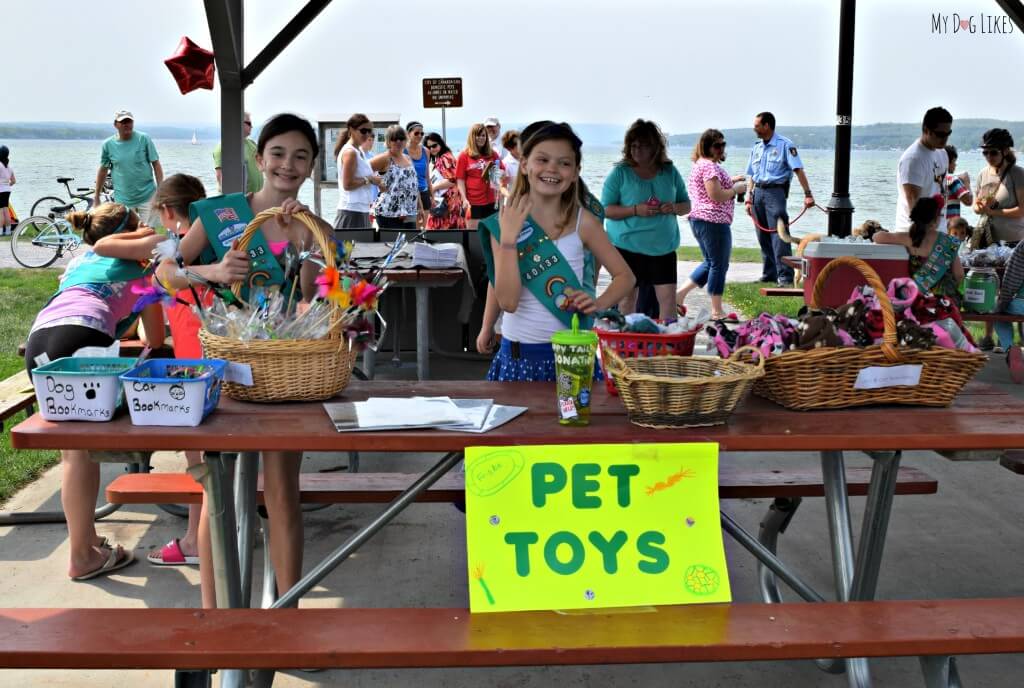 A couple local girl scouts displaying their homemade dog toys!