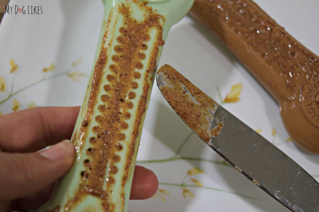 Spreading almond butter onto our Flavorit Bone