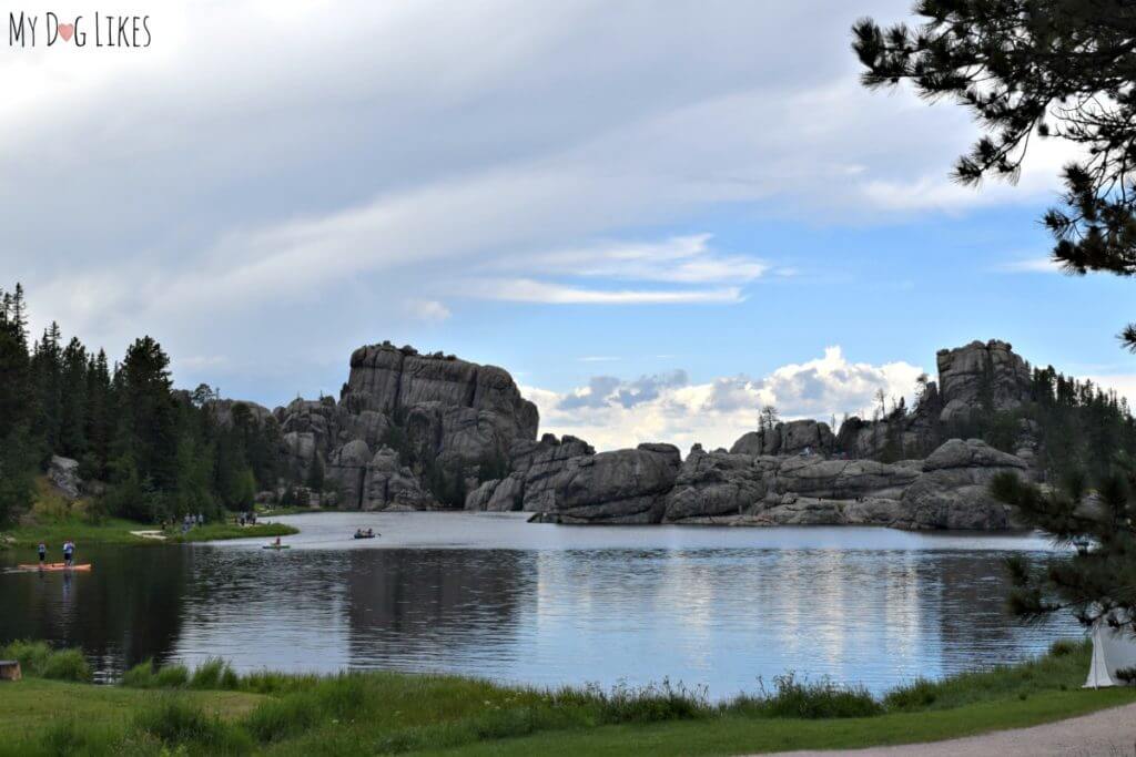The picturesque Sylvan Lake at Custer State Park surrounded by large granite peaks and spires.