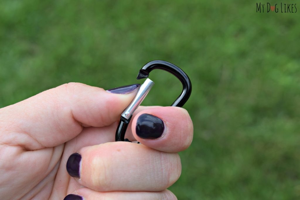 The Fetch It comes attached to a carabiner so it can be easily clipped to a leash or bag.