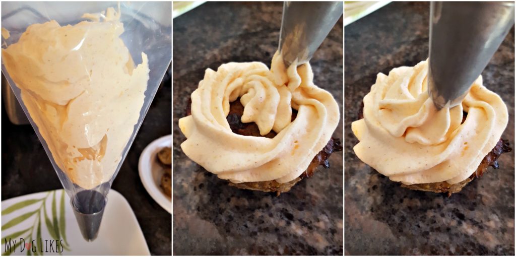 Using a piping bag to frost the cupcakes for dogs.