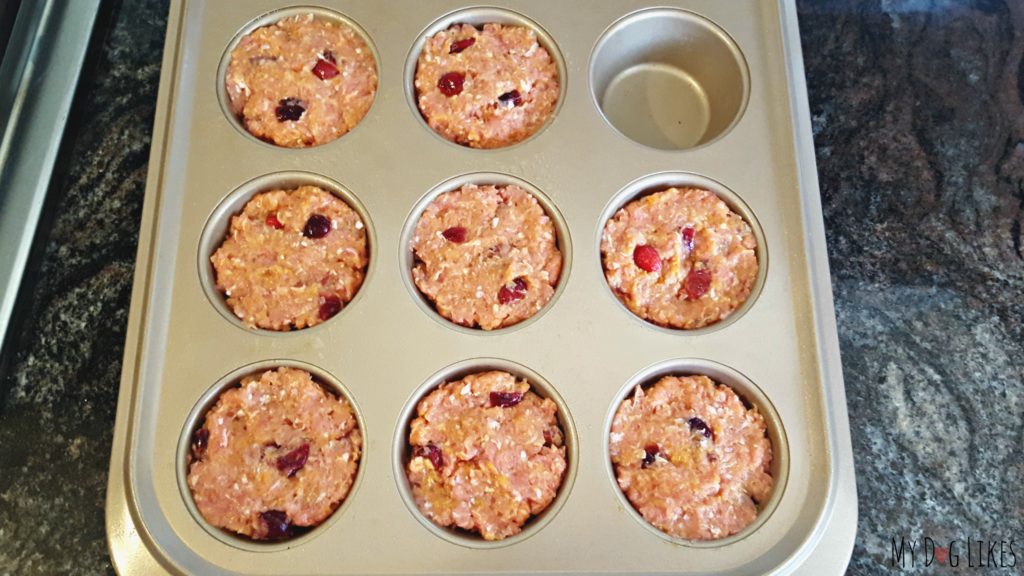 Flatten the pupcakes in the baking tin to make sure that they back evenly