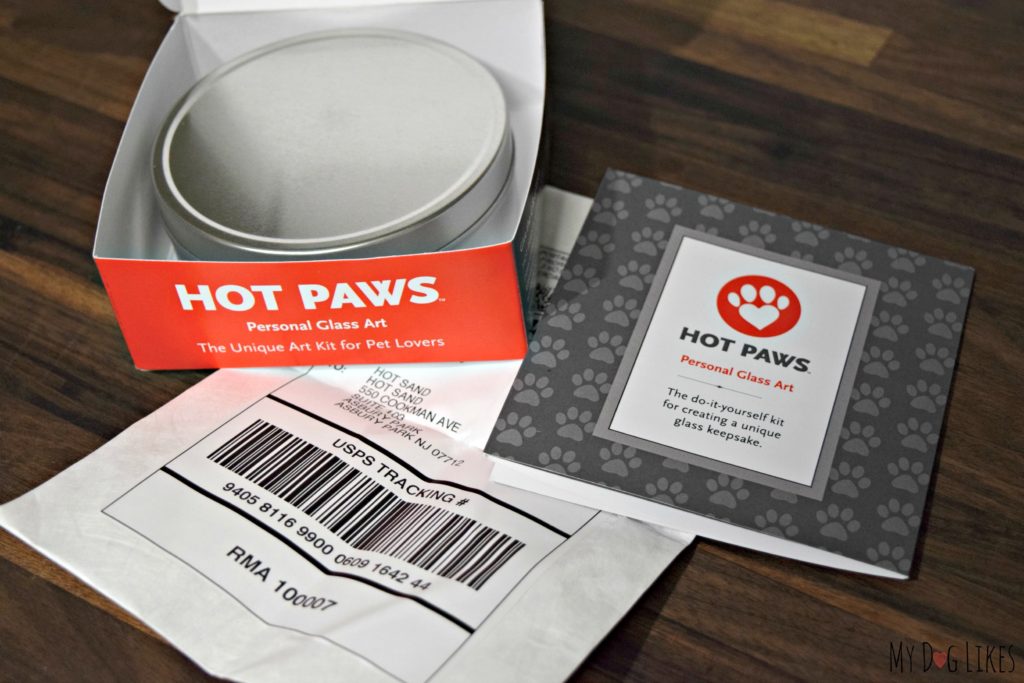 Opening up our Hot Paws Kit we find a tin full of molding material, instructions and a prepaid shipping label.